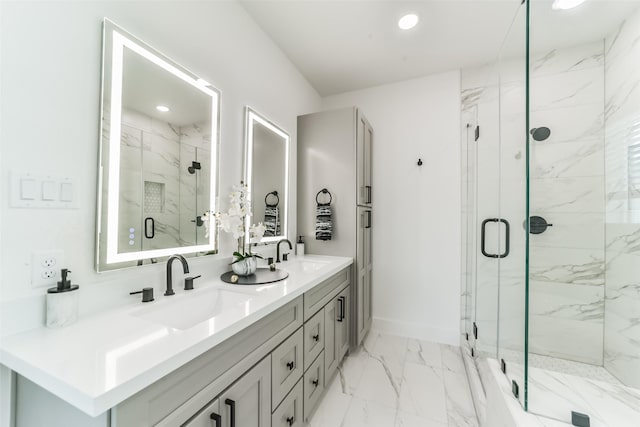 bathroom with an enclosed shower and vanity