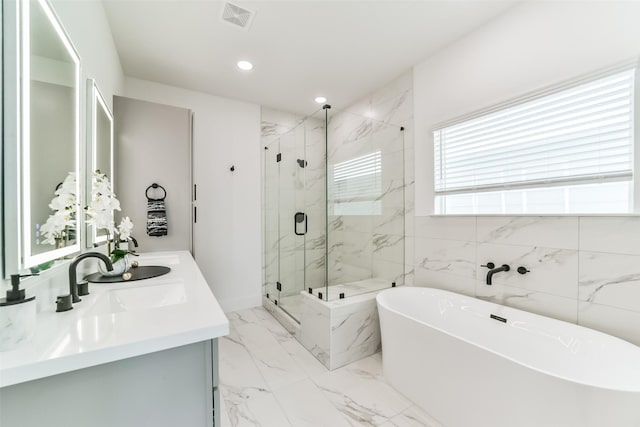 bathroom featuring separate shower and tub and vanity