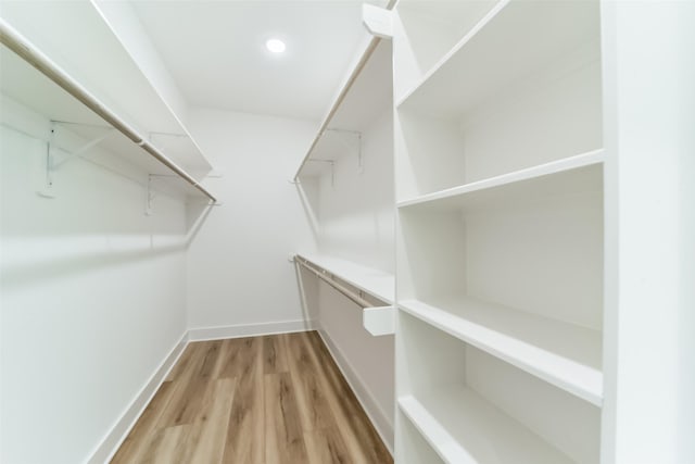 walk in closet featuring hardwood / wood-style floors