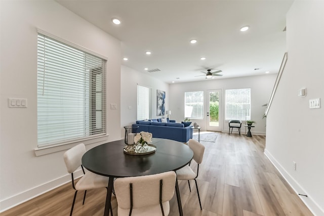 dining room featuring light hardwood / wood-style floors and ceiling fan