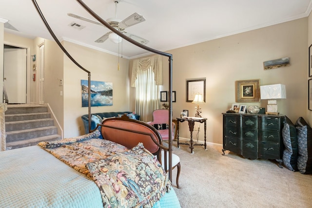 carpeted bedroom with crown molding and ceiling fan