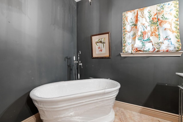 bathroom featuring vanity and a bathing tub