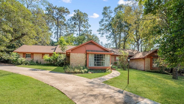 ranch-style home with a front lawn