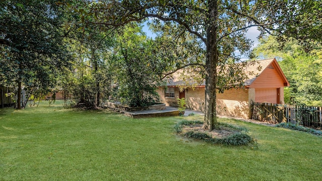 view of yard with a garage