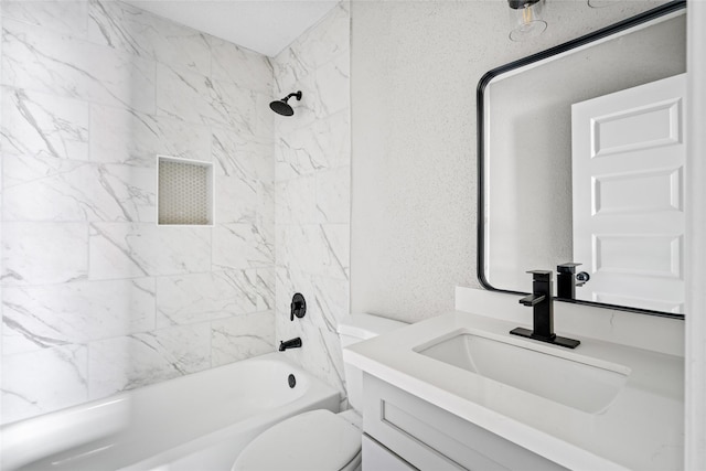 full bathroom featuring vanity, tiled shower / bath combo, and toilet