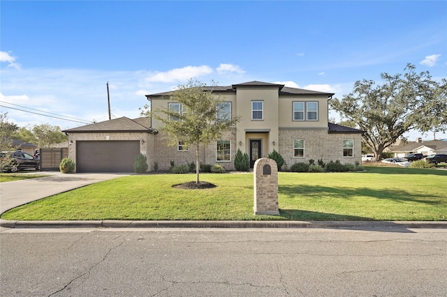 view of front facade featuring a garage and a front yard