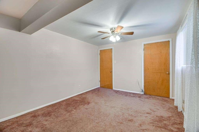 empty room featuring carpet and ceiling fan