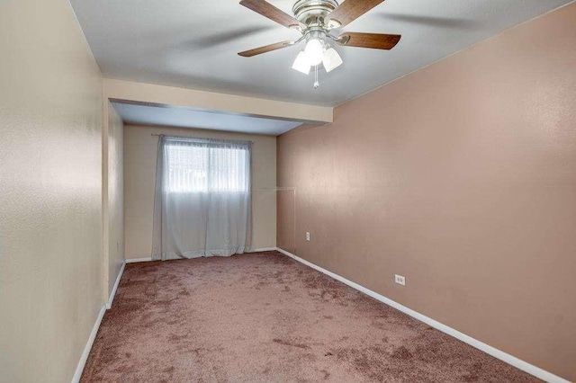 empty room with carpet and ceiling fan