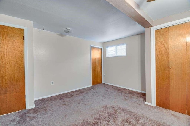 unfurnished bedroom with carpet and a closet