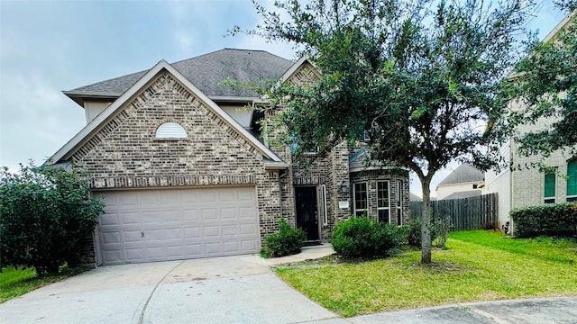 view of property with a front yard and a garage