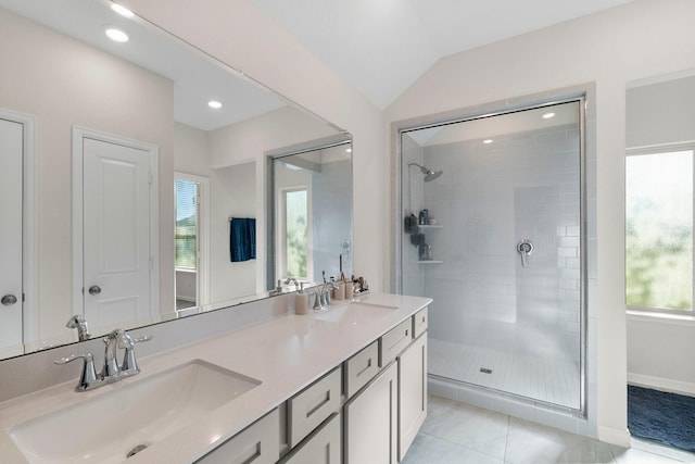 bathroom with plenty of natural light, an enclosed shower, vaulted ceiling, and tile patterned flooring