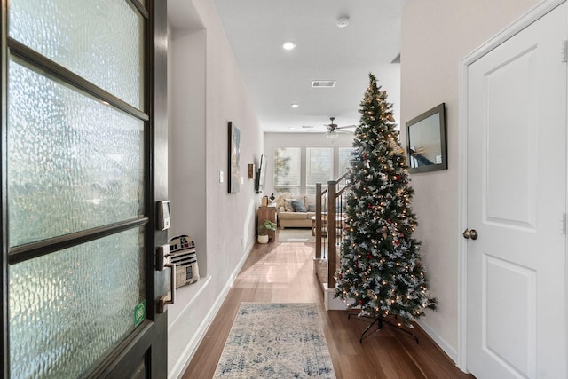 hallway with wood-type flooring