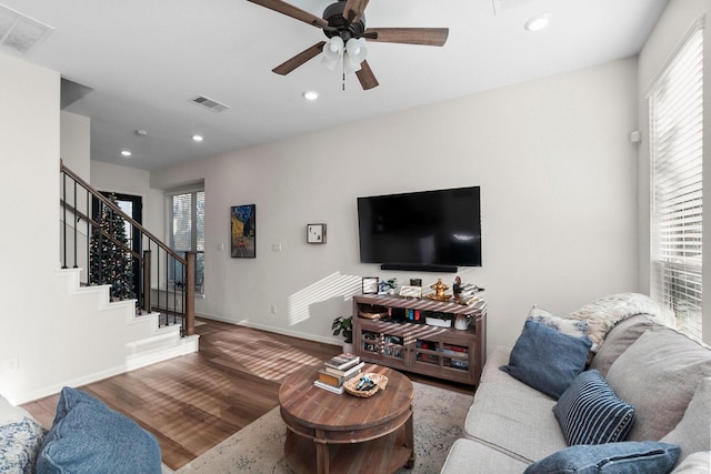 living room with ceiling fan and wood-type flooring