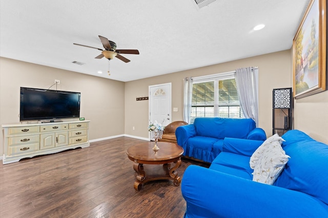 living room featuring hardwood / wood-style flooring and ceiling fan