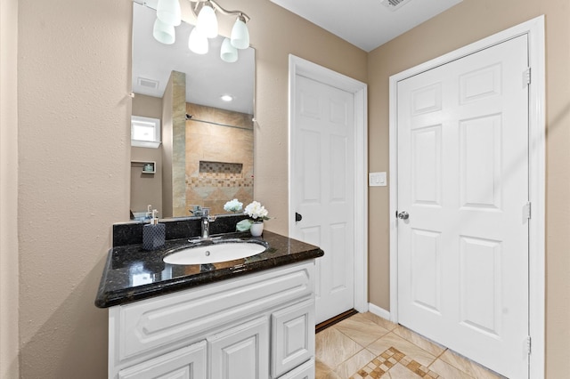 bathroom featuring tile patterned floors and vanity