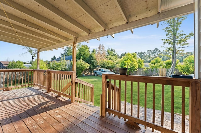 wooden terrace with a yard