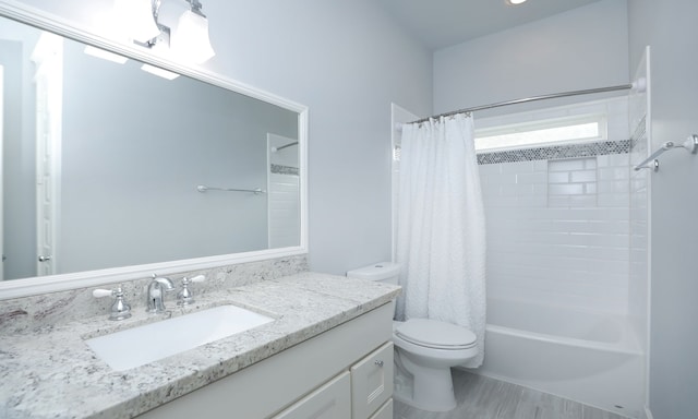 full bathroom with hardwood / wood-style flooring, shower / tub combo with curtain, vanity, and toilet