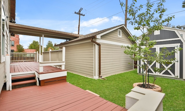 wooden deck with a shed and a lawn