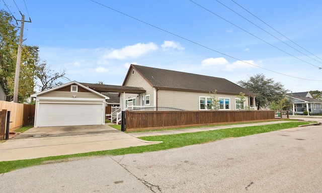 view of front of property with an outdoor structure and a garage