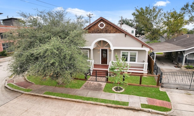 bungalow-style home featuring a porch and a front lawn