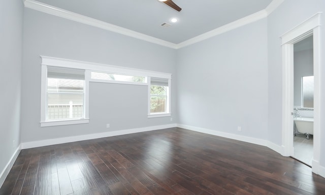 empty room featuring crown molding, dark hardwood / wood-style flooring, and ceiling fan