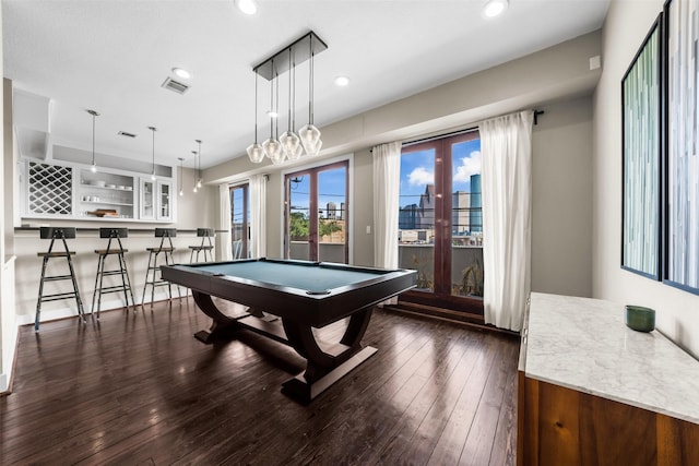 rec room featuring indoor bar, dark hardwood / wood-style flooring, and billiards