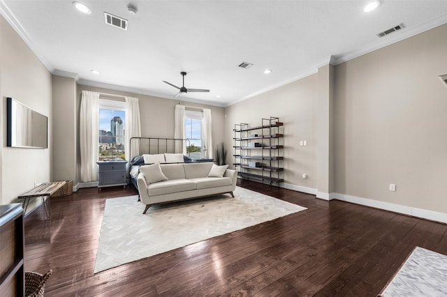 living room featuring crown molding, ceiling fan, and dark wood-type flooring