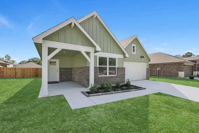 craftsman house with board and batten siding, brick siding, a front yard, and fence