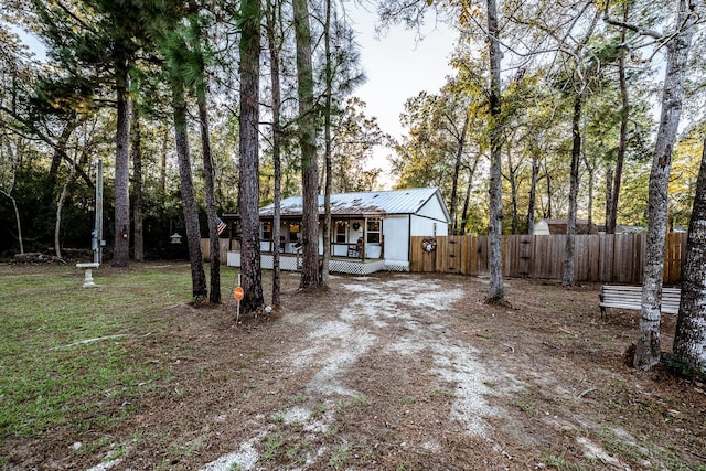 view of yard featuring covered porch