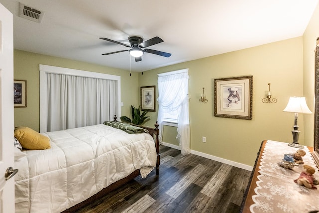 bedroom with ceiling fan and dark hardwood / wood-style flooring