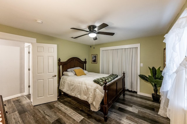 bedroom featuring dark hardwood / wood-style floors and ceiling fan