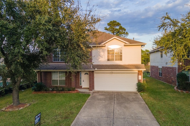 view of front of property with a garage and a front lawn