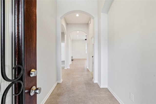 hallway with light tile patterned floors