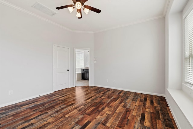 empty room featuring ceiling fan, dark hardwood / wood-style flooring, and ornamental molding