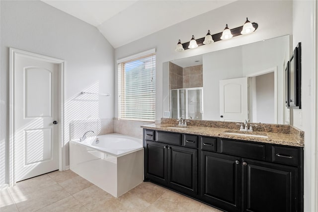 bathroom with tile patterned floors, separate shower and tub, vanity, and lofted ceiling