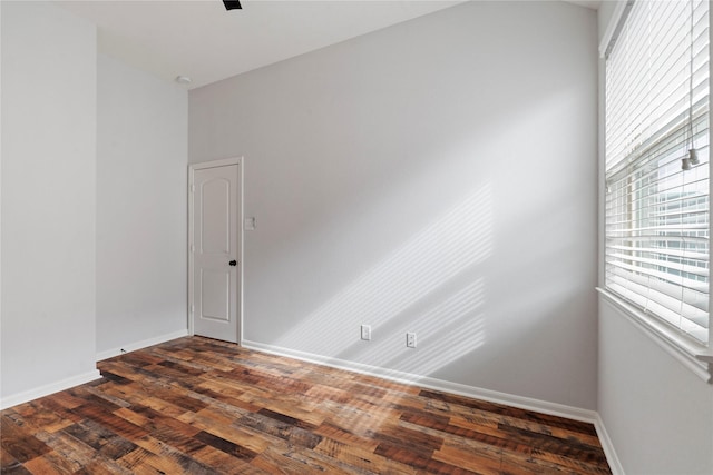 empty room featuring dark hardwood / wood-style floors