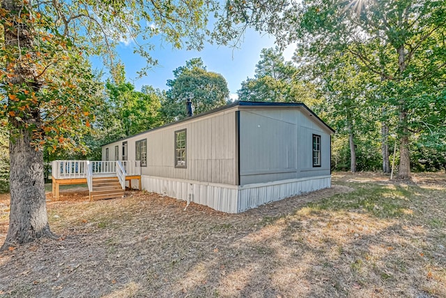 view of front of house featuring a wooden deck