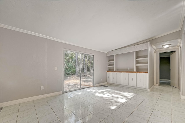 unfurnished living room with built in features, crown molding, a textured ceiling, vaulted ceiling, and light tile patterned flooring