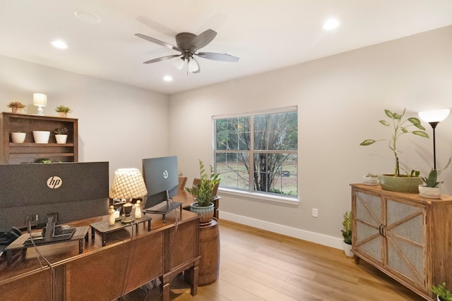 office space featuring light hardwood / wood-style flooring and ceiling fan