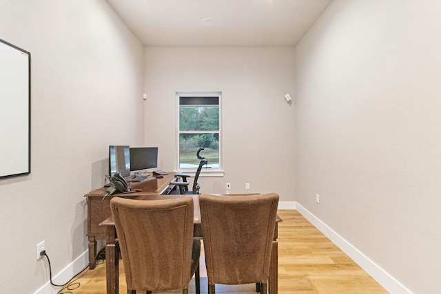 office with light wood-type flooring