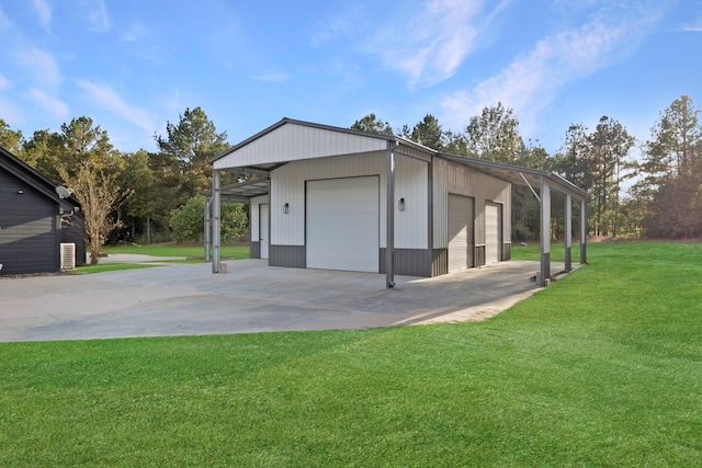 garage featuring a yard and a carport