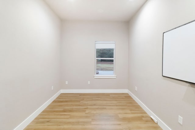 unfurnished room with light hardwood / wood-style flooring