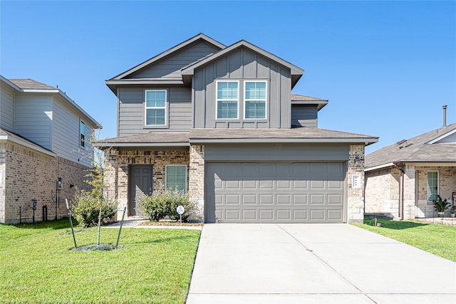 view of front of property with a front yard and a garage