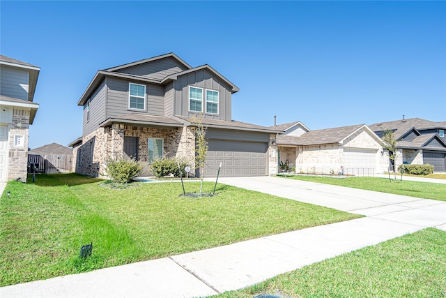 view of front of property featuring a garage and a front lawn