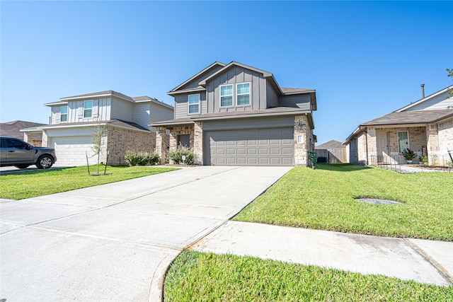 view of front of house featuring a garage and a front yard