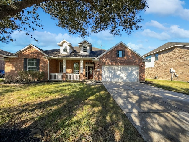 view of front of home featuring a porch, a garage, and a front yard