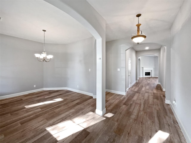 entrance foyer featuring dark hardwood / wood-style flooring and a chandelier