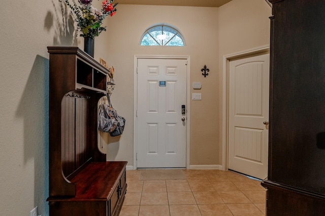 entryway with light tile patterned floors