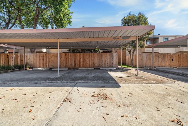 view of vehicle parking with a carport