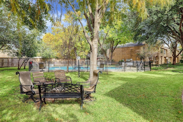 view of yard with a community pool